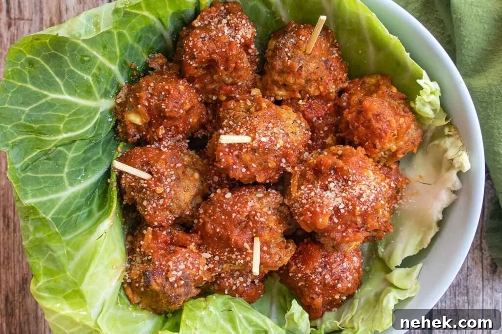 baked Italian meatballs in a bowl lined with cabbage leaf