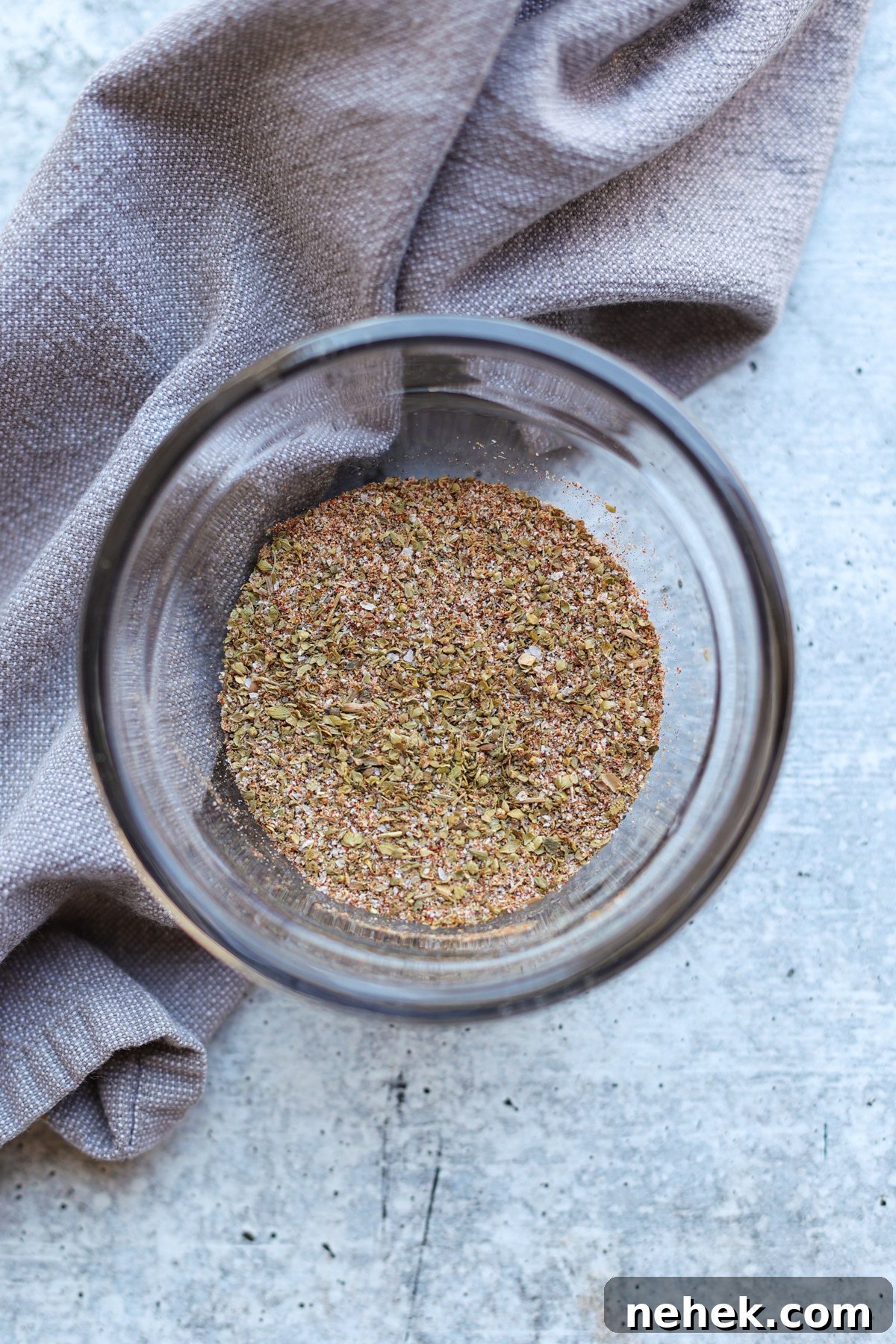 How to Smoke Chicken Leg Quarters for Juicy, Flavorful Results 5 Bowl filled with dry rub used to coat chicken.