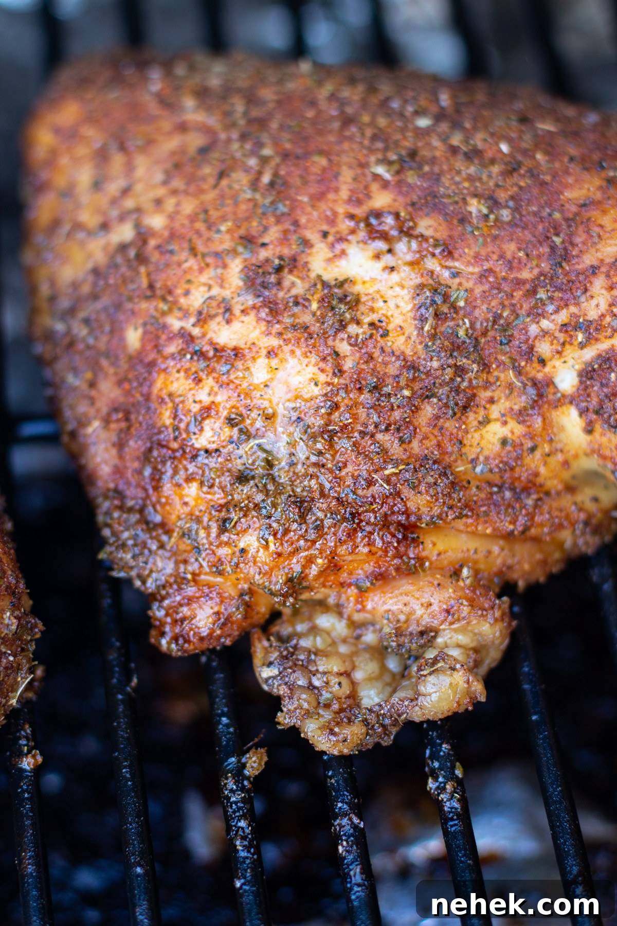 How to Smoke Chicken Leg Quarters for Juicy, Flavorful Results 9 Chicken leg quarter covered in a spice rub on a smoker.