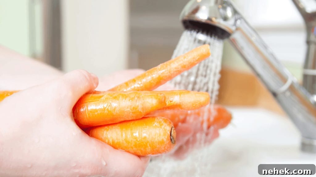 Washing carrots before shredding