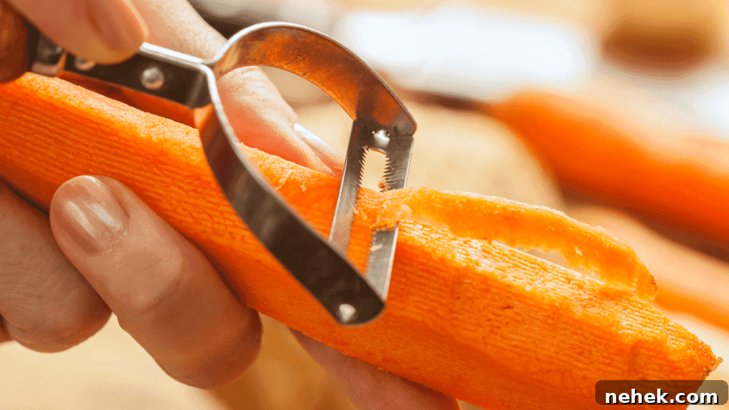 Peel carrots using a peeler