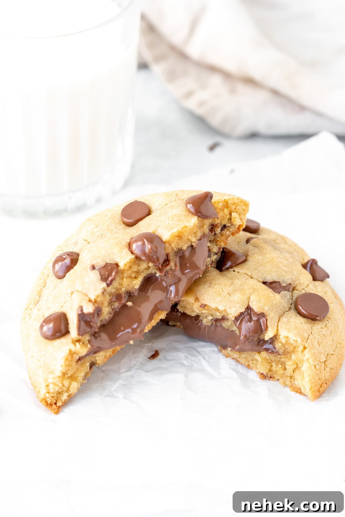 Large Nutella stuffed chocolate chip cookie broken in half