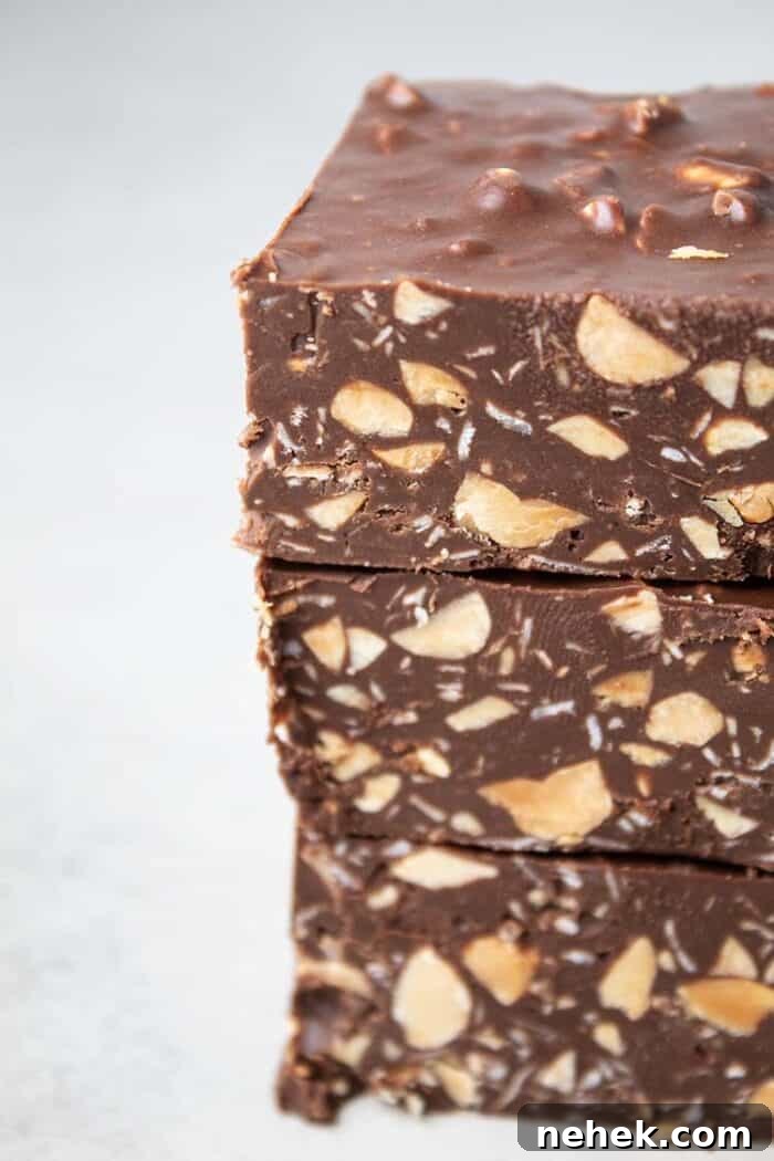 sideview of stack of three homemade cruch bars that are low carb, sugar free, gluten free, keto and healthy on a white background