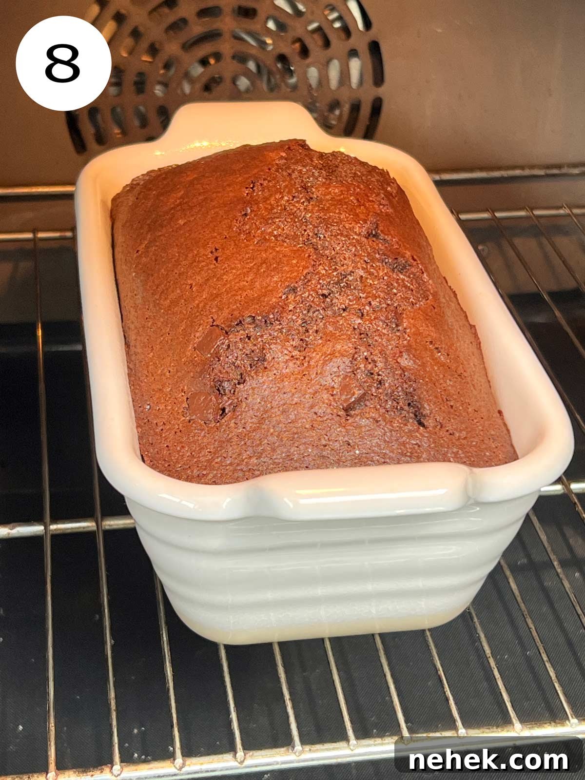 Ultimate Moist Chocolate Cake Recipe for Rich, Decadent Results 11 Fluffy and moist chocolate cake beautifully baked in white rectangular oven dish.