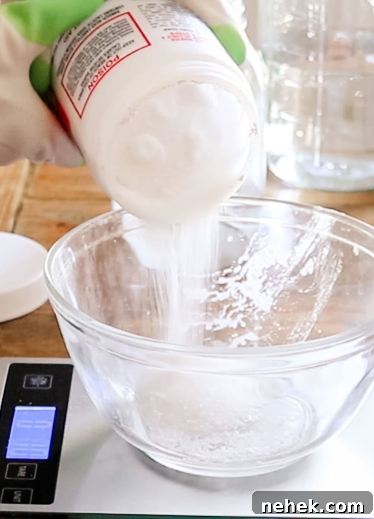 Homemade Turmeric Soap Recipe for Glowing Skin 6 Pouring lye into a glass bowl on a digital scale.