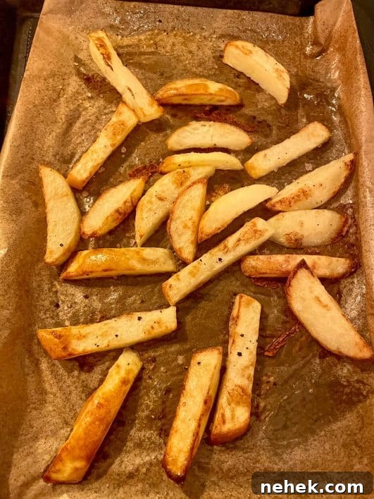 Healthy Oven Chips Slimming style baked golden brown on a baking sheet