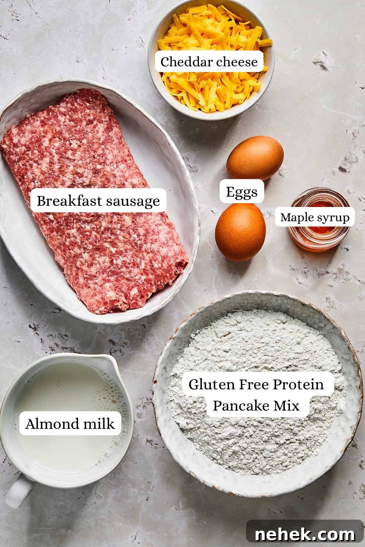 Ingredients laid out for McGriddle muffins, including sausage, pancake mix, and maple syrup