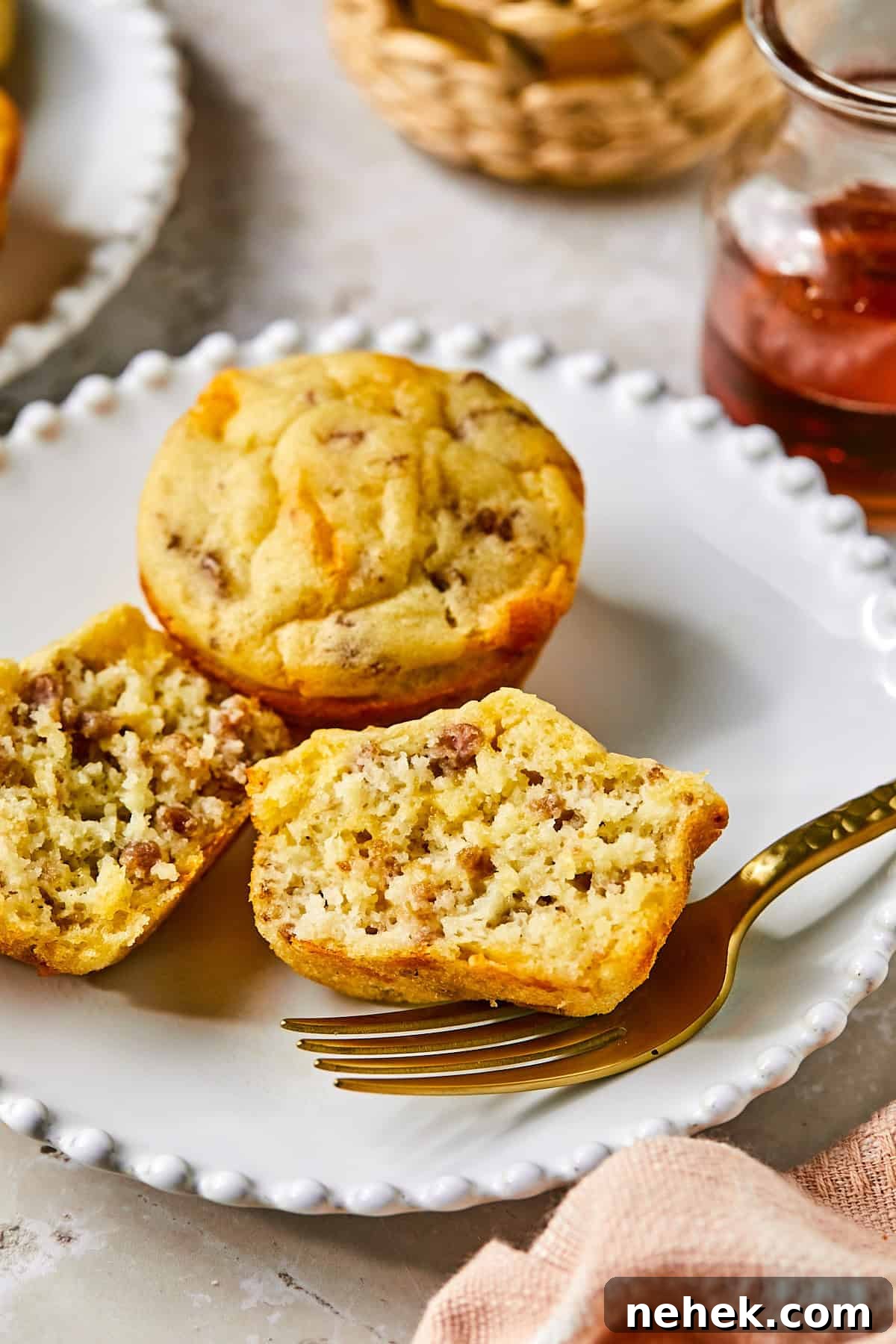 Side view of sliced McGriddle muffin showing sausage and fluffy pancake texture inside
