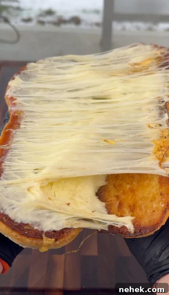 Juicy grilled chicken sandwich with bacon, melted cheddar, and fresh toppings on a toasted roll.