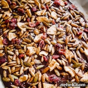 Fall Chocolate Bark with Dried Apples and Roasted Pepitas in pan