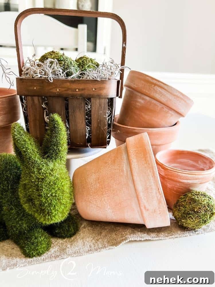 neutral Easter centerpiece with clay pots and baskets