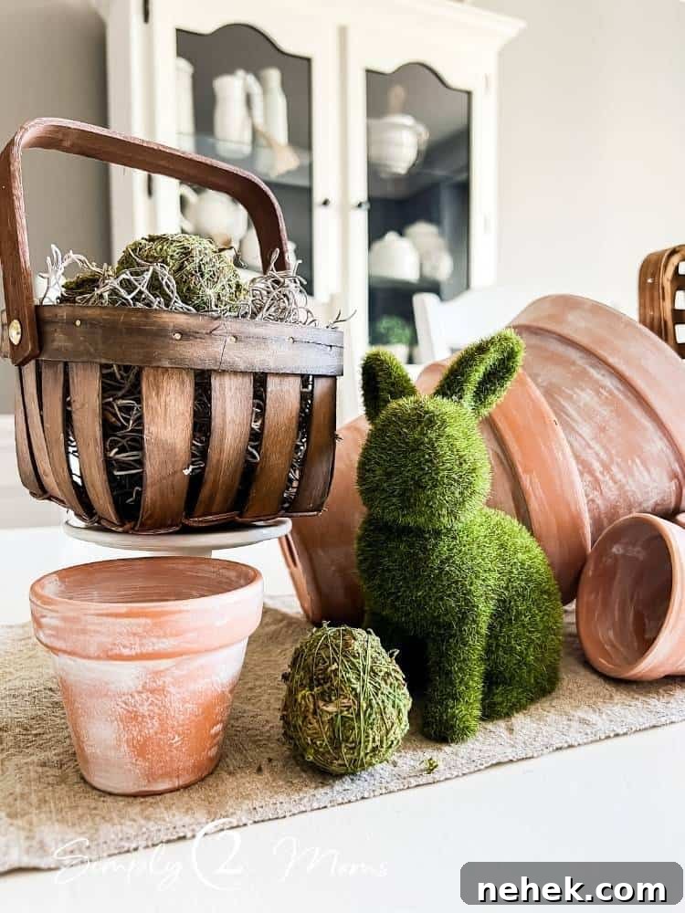 mini basket filled with moss grass on pedestal in spring centerpiece