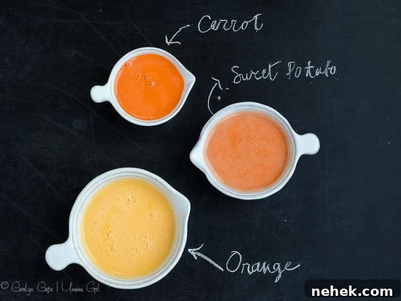 small pitchers with carrot juice, sweet potato juice, and orange juice on a chalkboard background