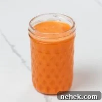 sweet potato, carrot, and orange juice in a small glass