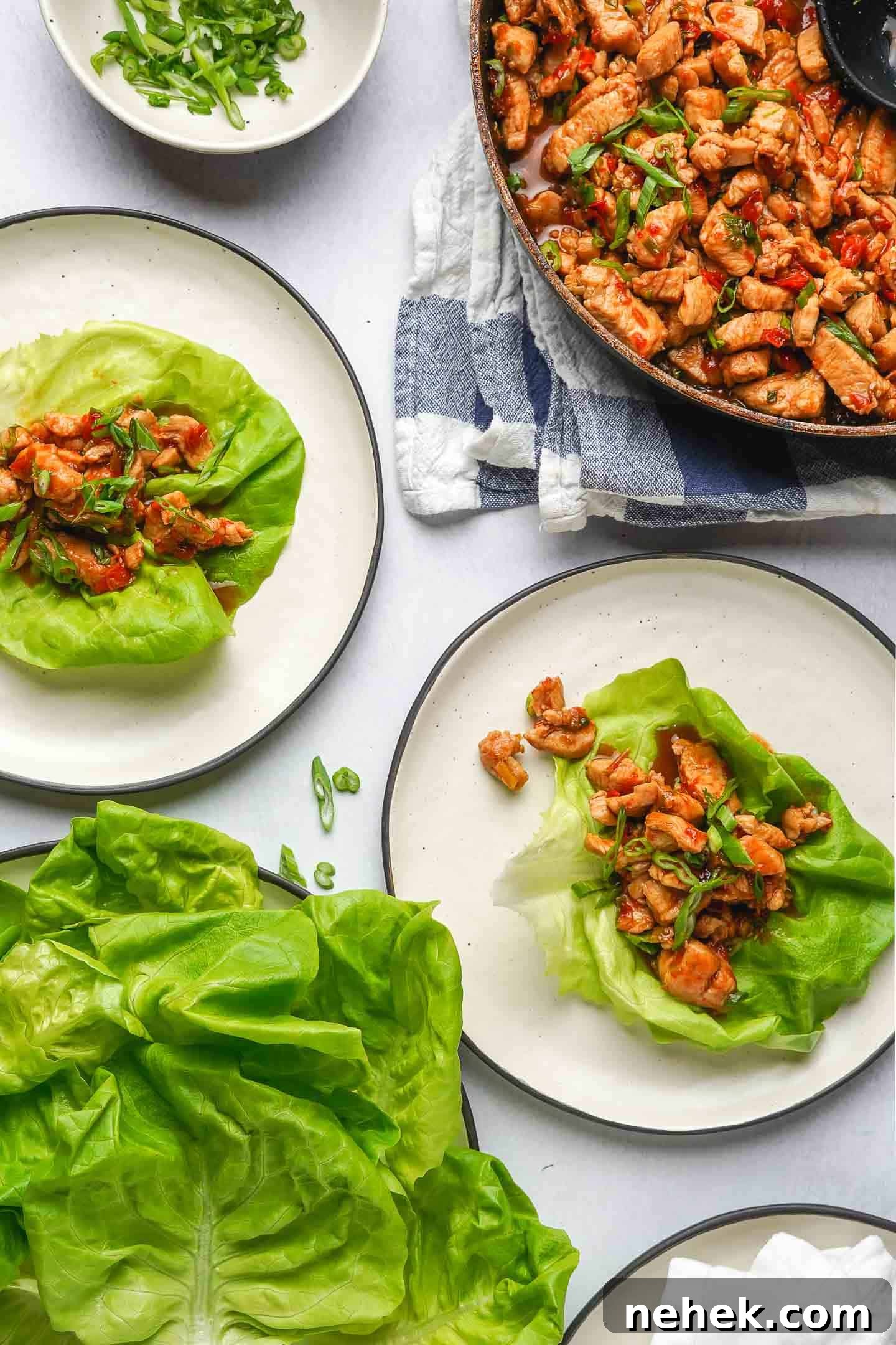 Teriyaki Chicken Lettuce Wraps Recipe for Quick Weeknight Meals 2 Teriyaki Chicken Lettuce Wraps Ready to Eat on two plates with lettuce on the side