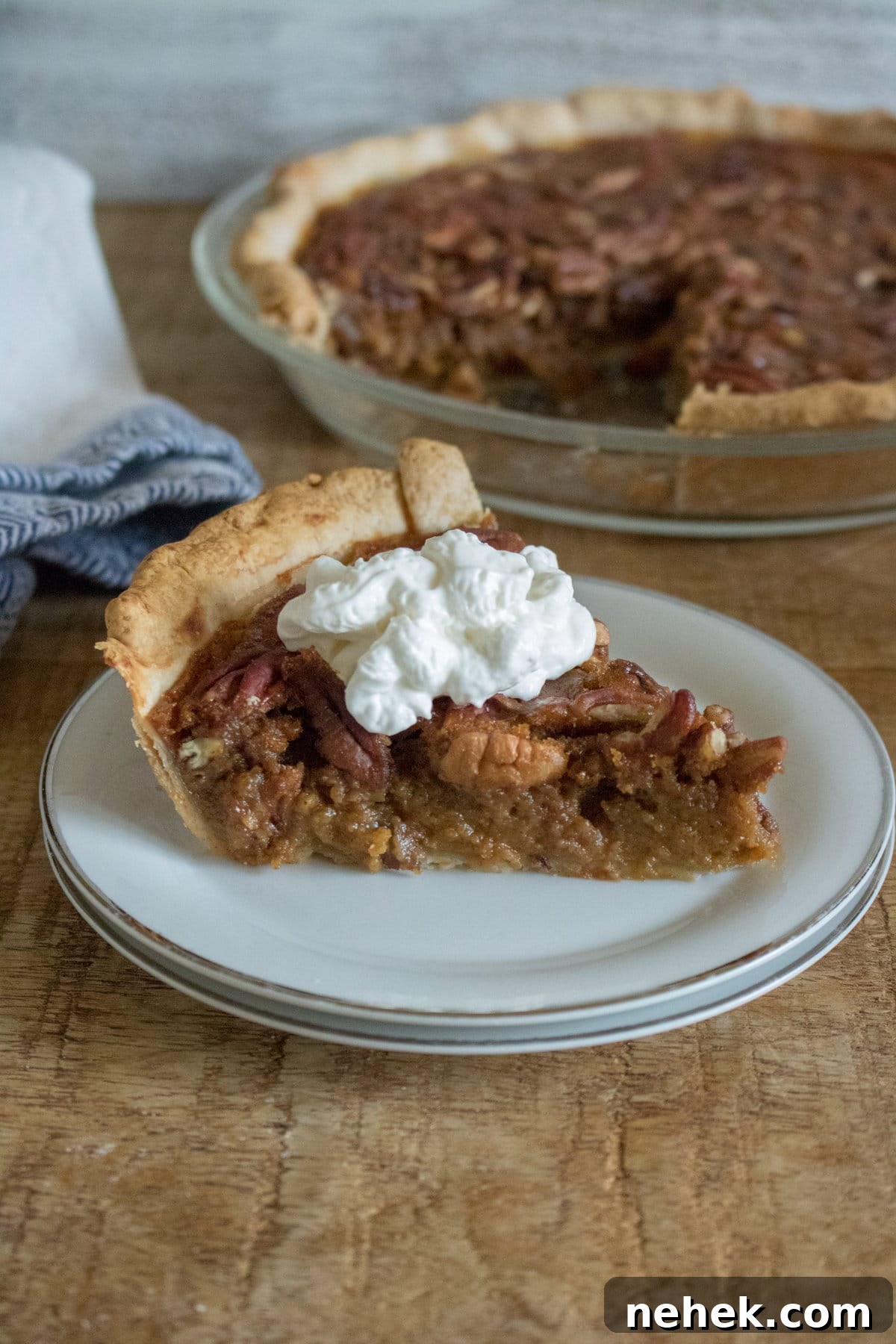 Pumpkin pecan pie slice on a plate.