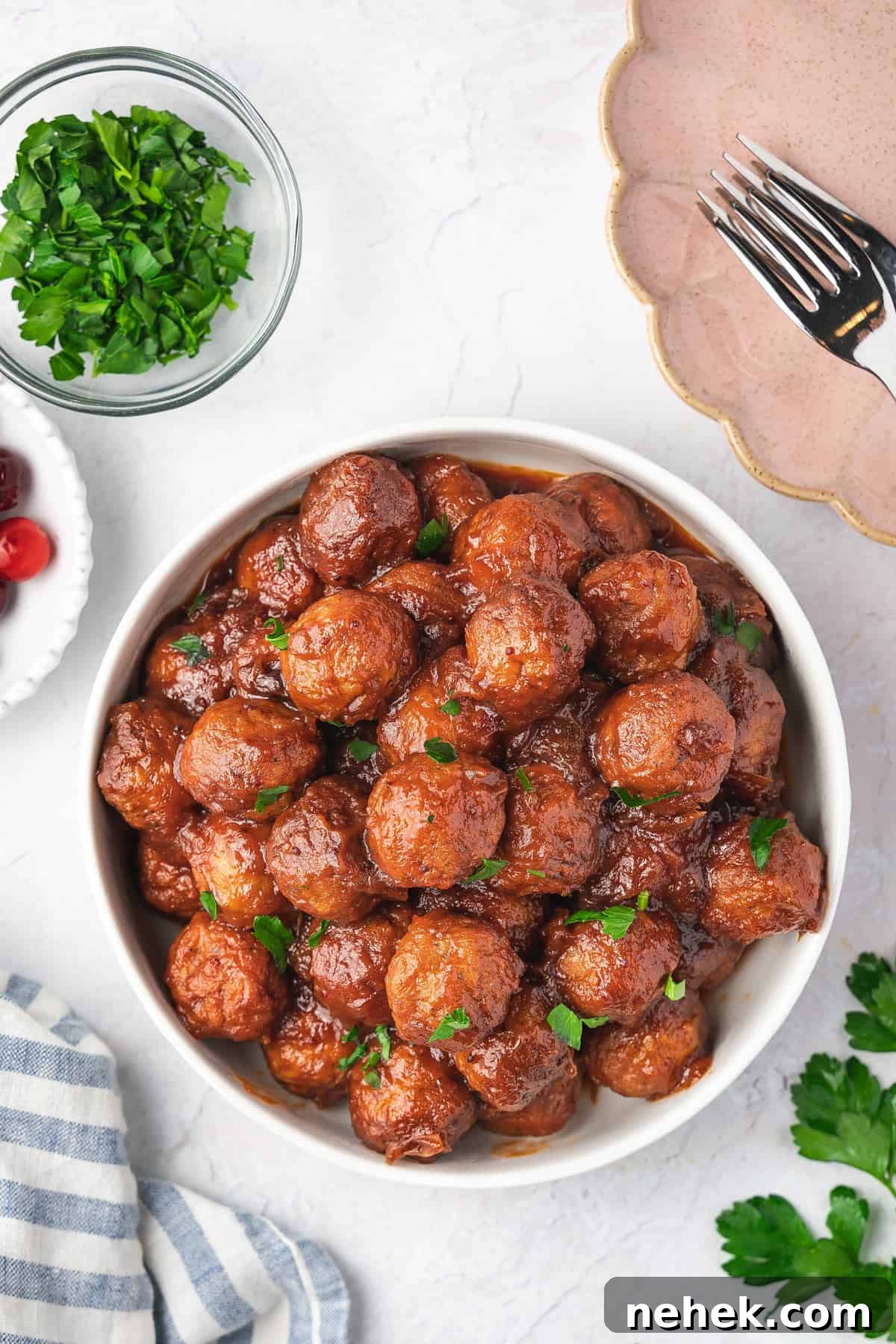 Overhead view of a bowl of slow cooker cranberry meatballs.