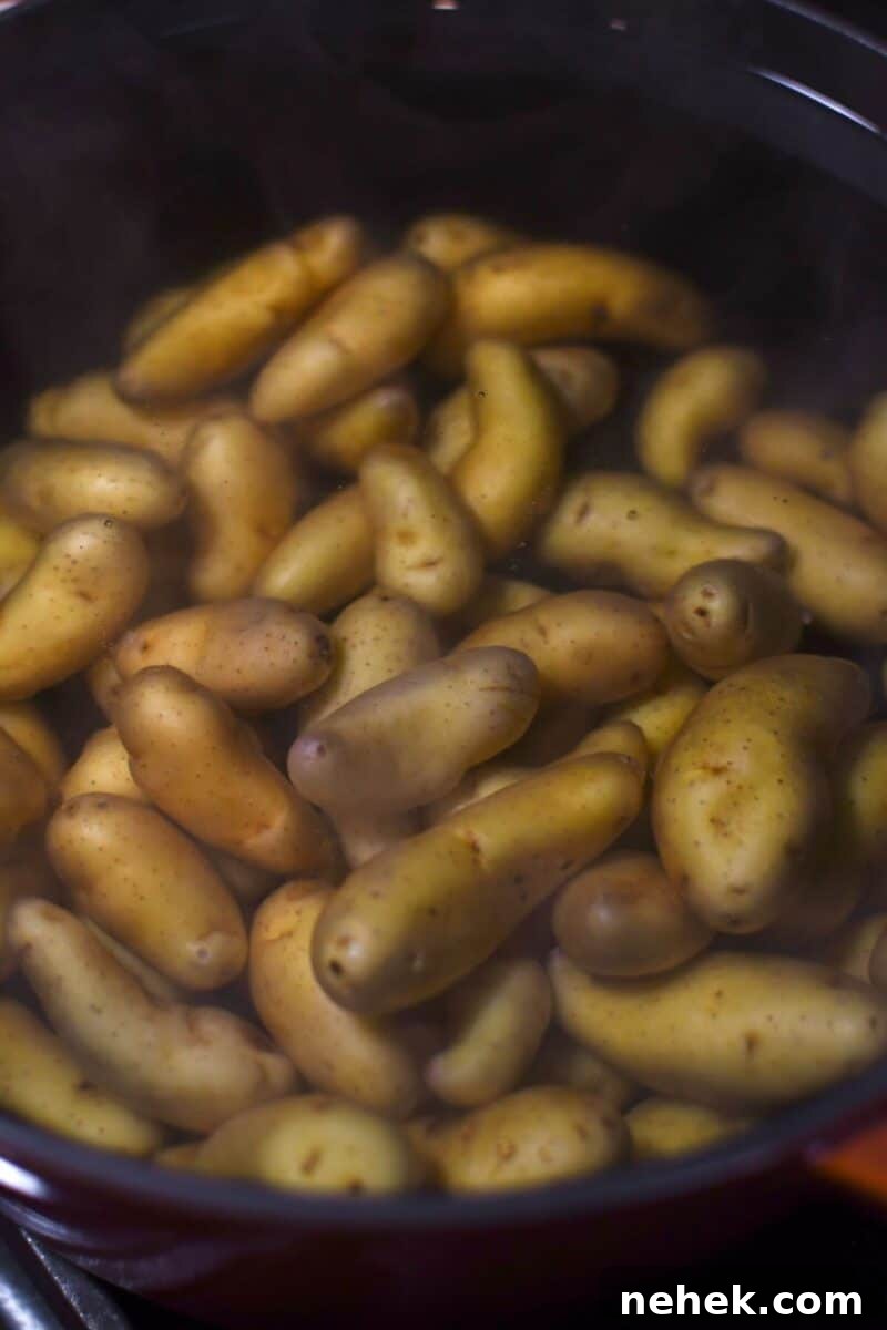 Crispy Smashed Potatoes with Garlic and Herbs 4 Potatoes placed in boiling water to be par cooked before smashing.