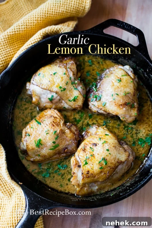 Baked Garlic Chicken Thighs Recipe in Creamy Garlic Lemon Sauce in a cast iron skillet 
