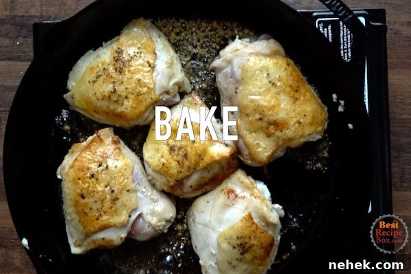 Chicken in skillet ready to be put in oven