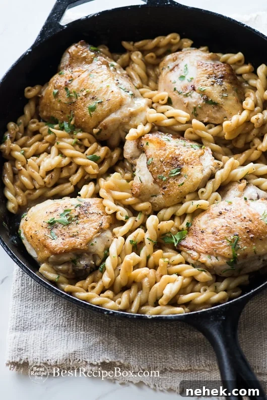 Baked Garlic Chicken Thighs in a cast iron with skillet 
