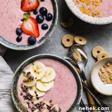 pink smoothie bowls topped off with fresh fruit