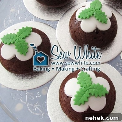 decorating the little Christmas Pudding Cakes with stamped out holly leaves