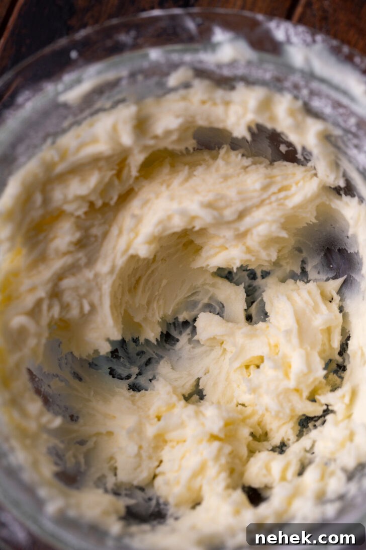 Silky Mascarpone Frosting Recipe for Cakes and Cupcakes 4 Mixed mascarpone in a bowl.