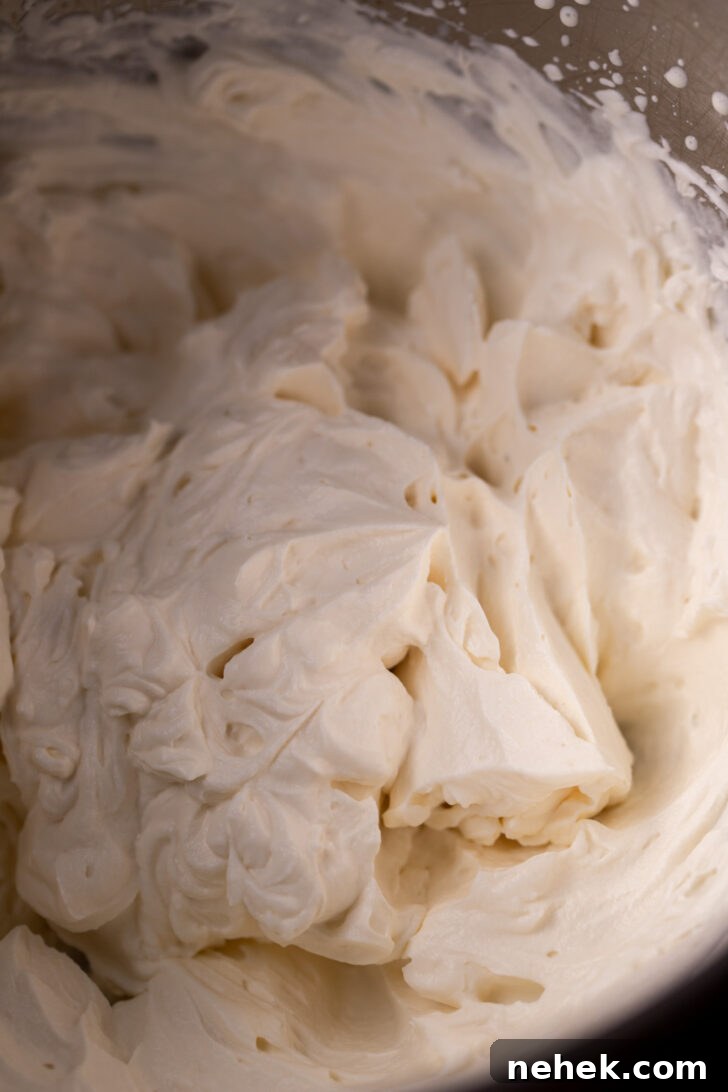 Silky Mascarpone Frosting Recipe for Cakes and Cupcakes 6 Mascarpone cream in a metal bowl.