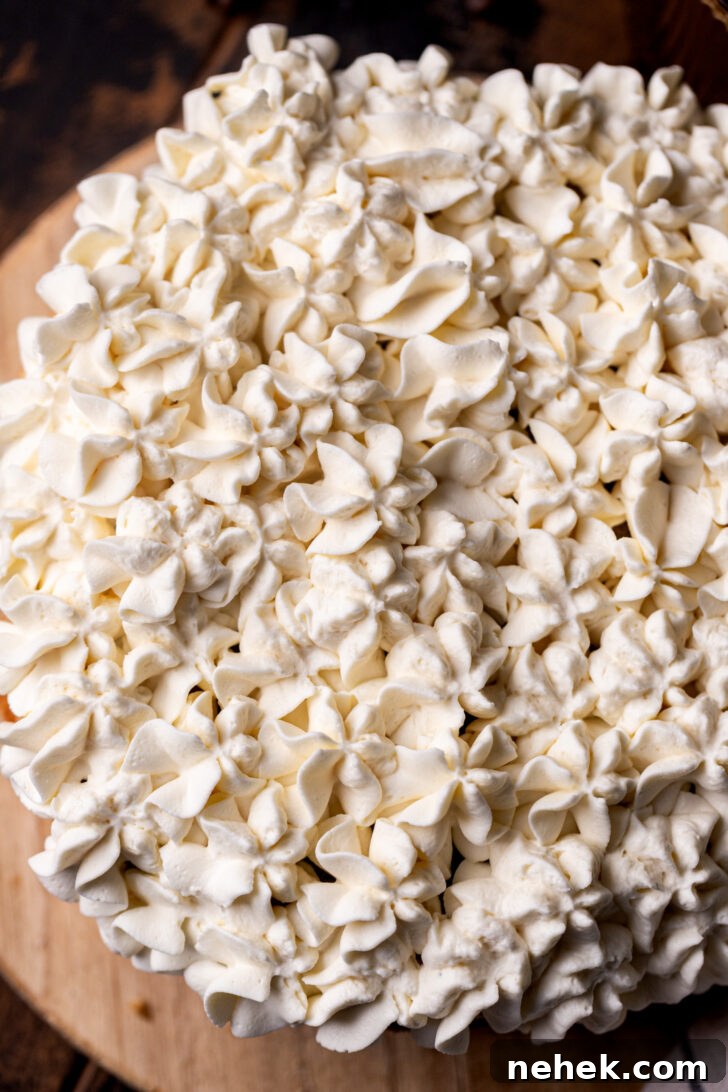 Silky Mascarpone Frosting Recipe for Cakes and Cupcakes 7 Piped mascarpone on top of the cake.