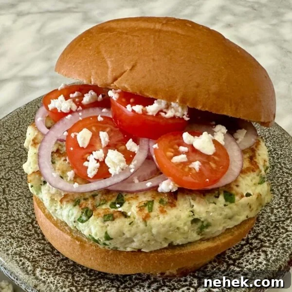 Chicken Parmesan Burger Recipe: Crispy, Cheesy Sandwiches 11 Spinach and Feta Turkey Burgers on a serving plate.
