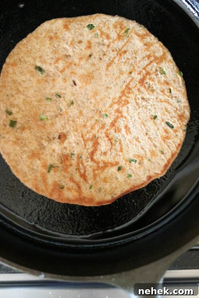flatbread cooking in a cast iron skillet