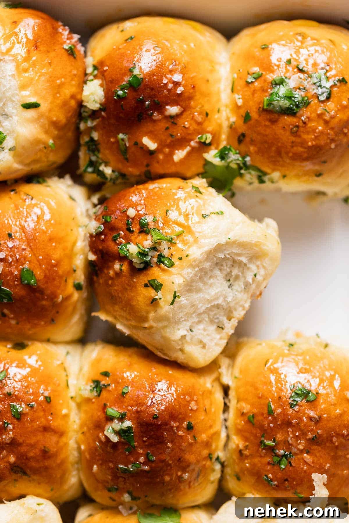 rolls with garlic butter and parsley on top. 