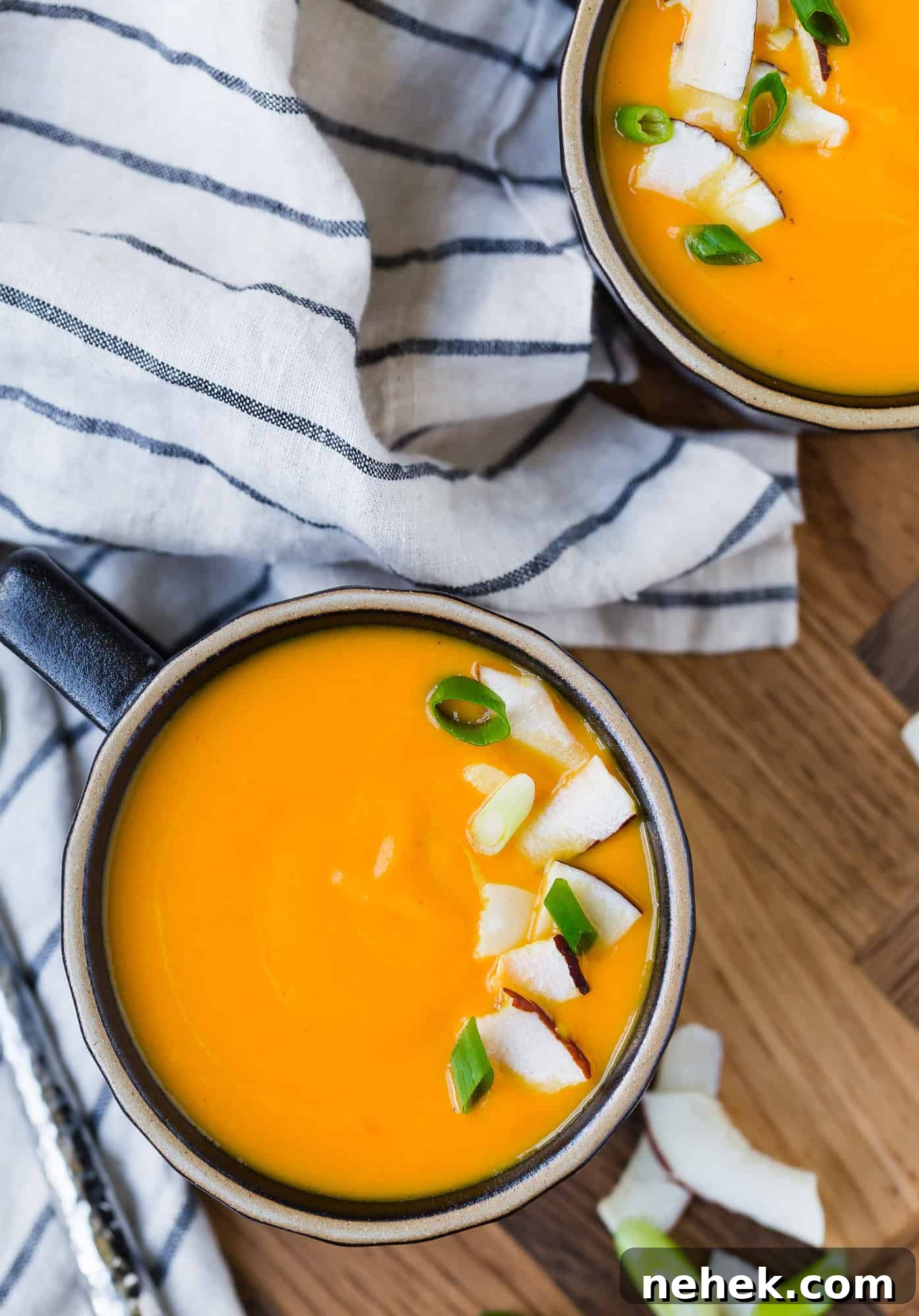 Vibrant Carrot Ginger Soup — Vegan & Whole30-Friendly Recipe 2 Overhead view of bright orange carrot soup.