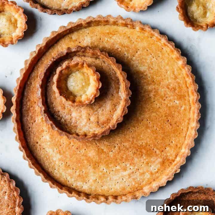 Pear Tart with Hazelnut Frangipane Recipe for a Crispy, Nutty Dessert 6 Golden brown baked tart shells in tartlet, mini and large sizes.