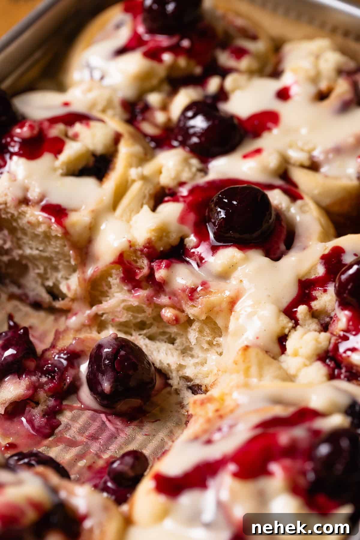 Cherry Pie Rolls with Crunchy Pie Crumb Topping 2 Cherry pie cinnamon rolls in a baking pan, swirled with cherry filling and topped with pie crumb.