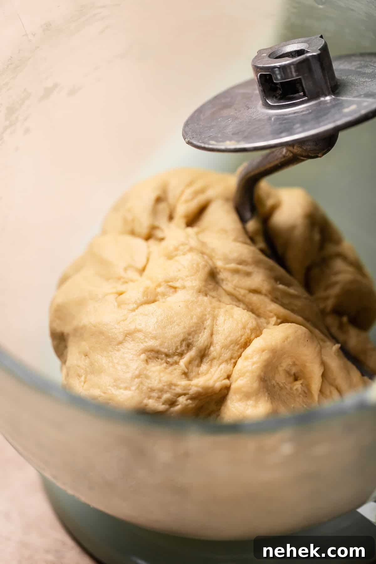 Cherry Pie Rolls with Crunchy Pie Crumb Topping 6 Smooth elastic cinnamon dough ball in glass mixer bowl.