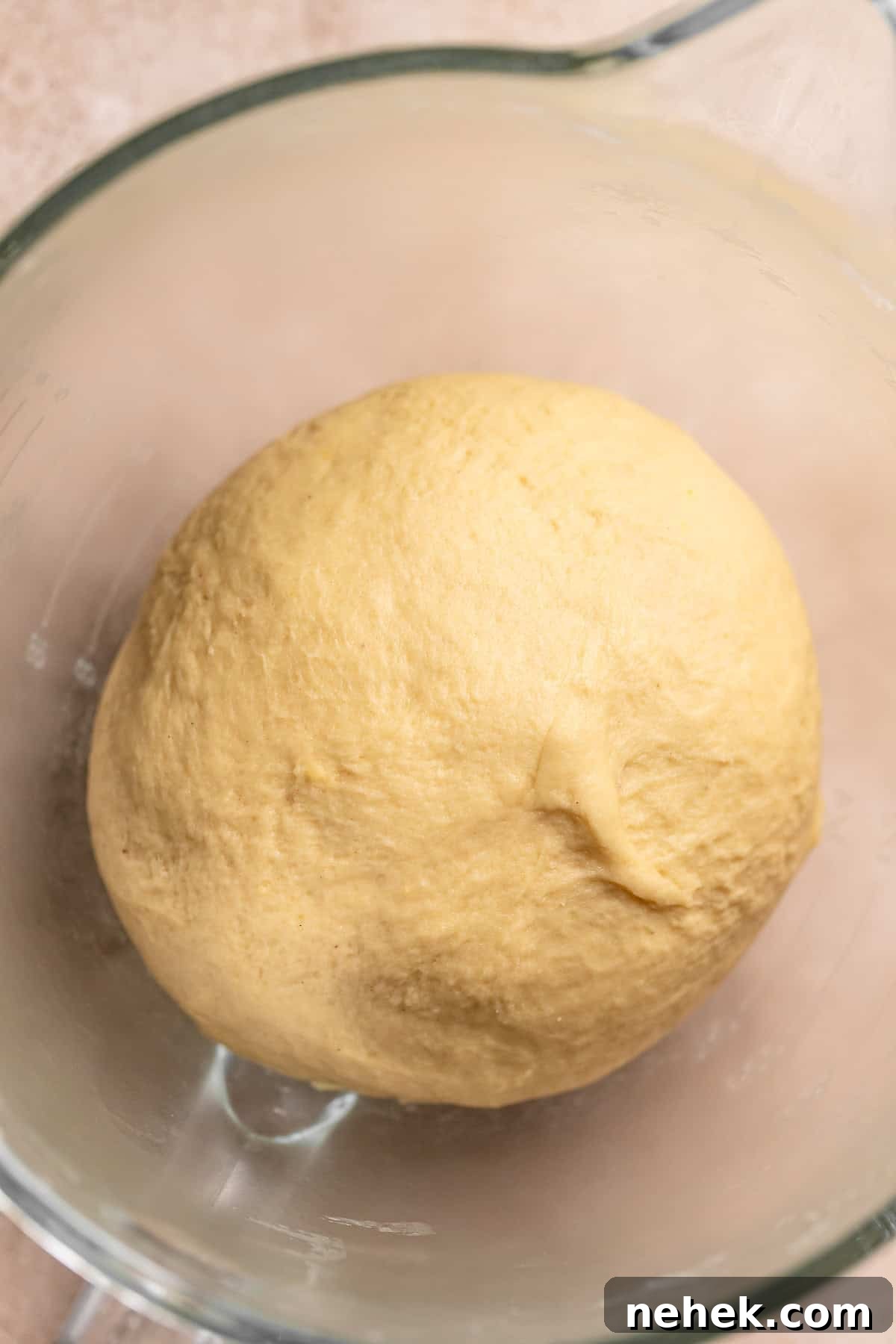 Cherry Pie Rolls with Crunchy Pie Crumb Topping 7 Cherry cinnamon roll dough shaped into a ball in a mixer bowl.