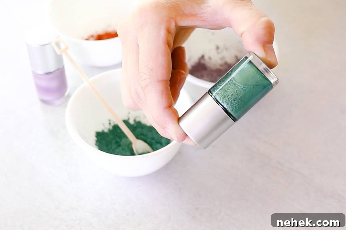 Shaking the bottle of nail polish to disperse the mica into the suspension base. 