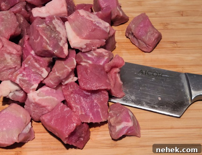 Cubed Petite Sirloin on a cutting board 