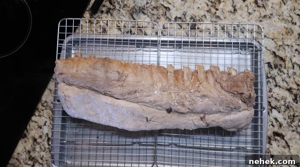 Placing ribs on baking sheet with wire rack