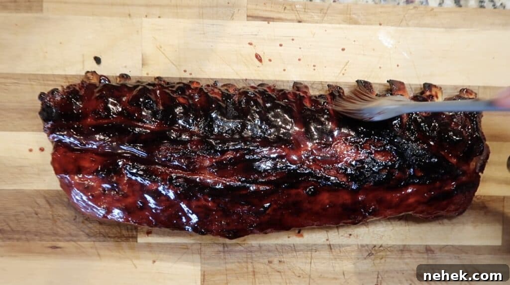 Brushing char siu sauce onto ribs
