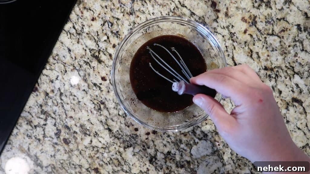 Adding red food dye to sauce