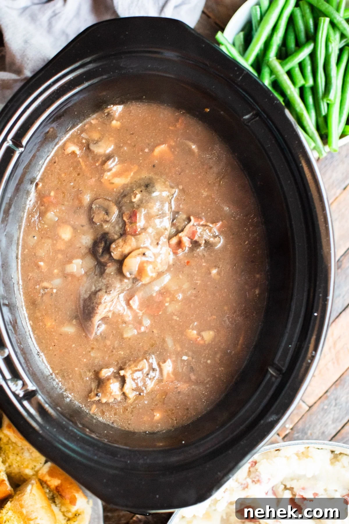 Slow-Cooked Venison Roast with Savory Mushroom Gravy 2 cooked venison roast in mushroom bacon gravy