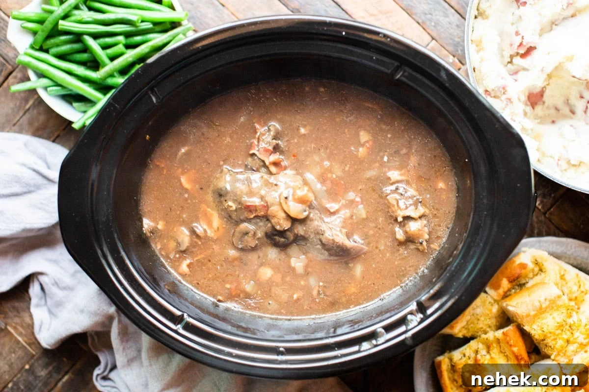 Slow-Cooked Venison Roast with Savory Mushroom Gravy 7 venison roast in bacon gravy, done cooking