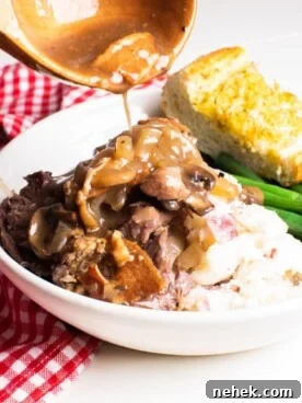Slow-Cooked Venison Roast with Savory Mushroom Gravy 9 gravy being poured over venison roast
