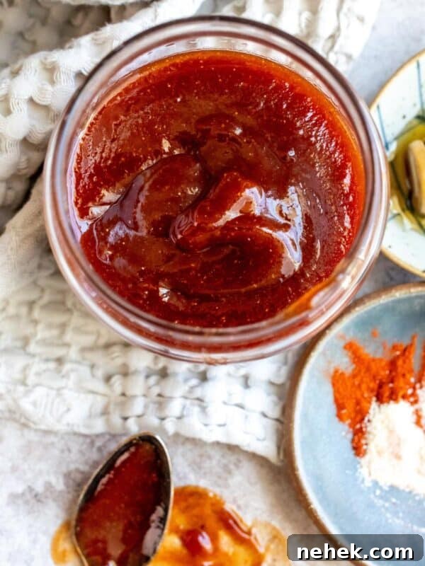 An image of honey bbq sauce in a small bowl.