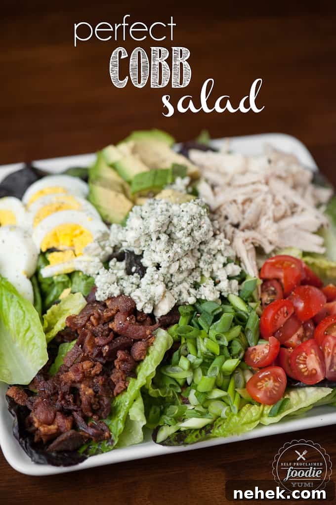 Perfect Cobb Salad has everything you want in a delicious salad including lots of greens, crisp bacon, shredded chicken, bleu cheese, hard boiled egg, ripe avocado, and tomatoes! This salad recipe is super easy to make and makes for an incredibly satisfying low carb complete meal. #cobbsalad #salad #bacon #chicken #greens #bluecheese #avocado #tomato #egg #hardboiledegg Perfect Cobb Salad