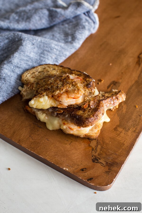 Shrimp Grilled Cheese: melted cheddar, buttered toast, and large grilled shrimp.