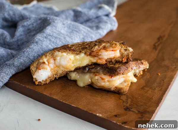 Shrimp Grilled Cheese: melted cheddar, buttered toast, and large grilled shrimp.